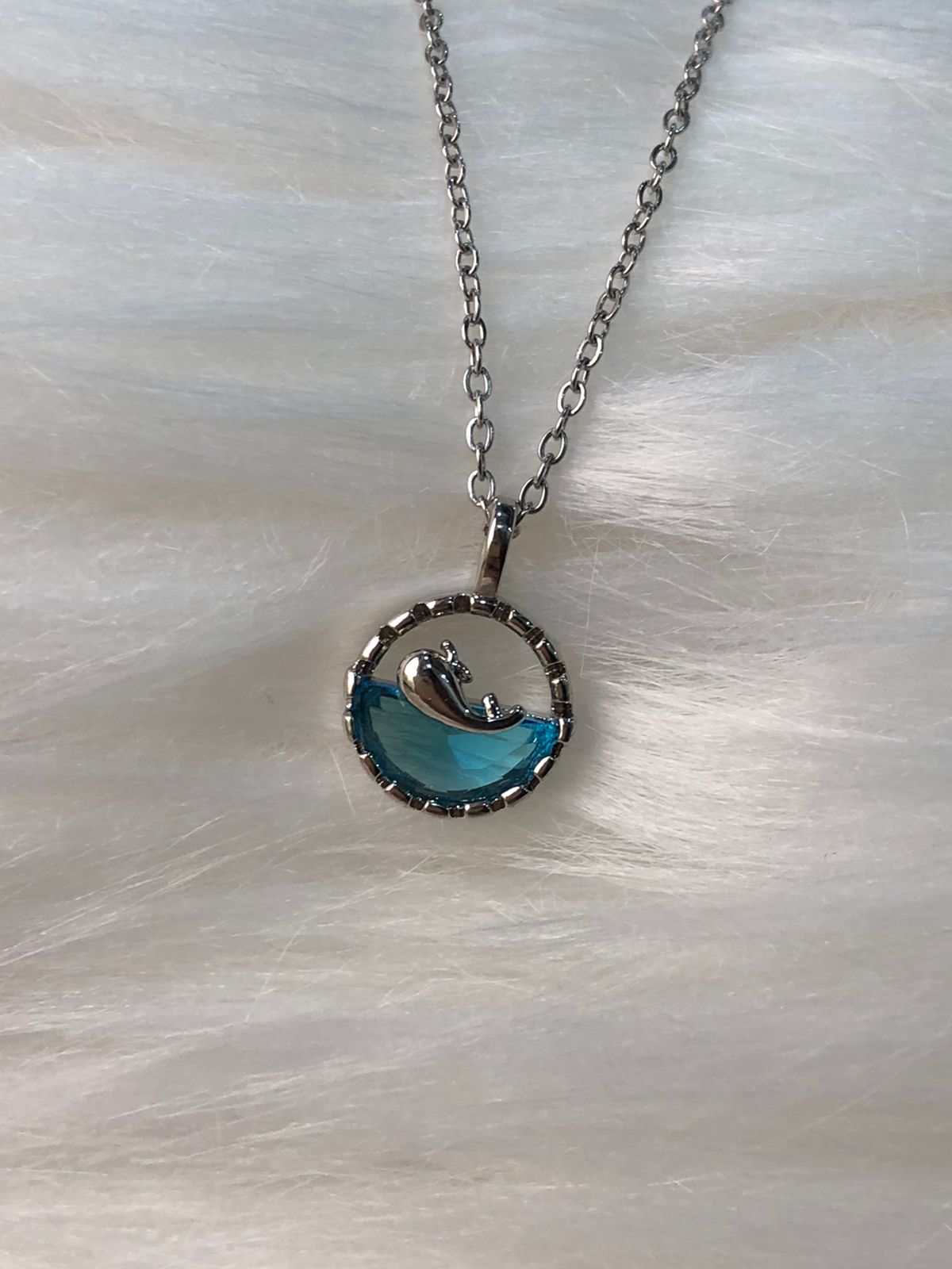 A whale shaped pendant necklace for women in blue color