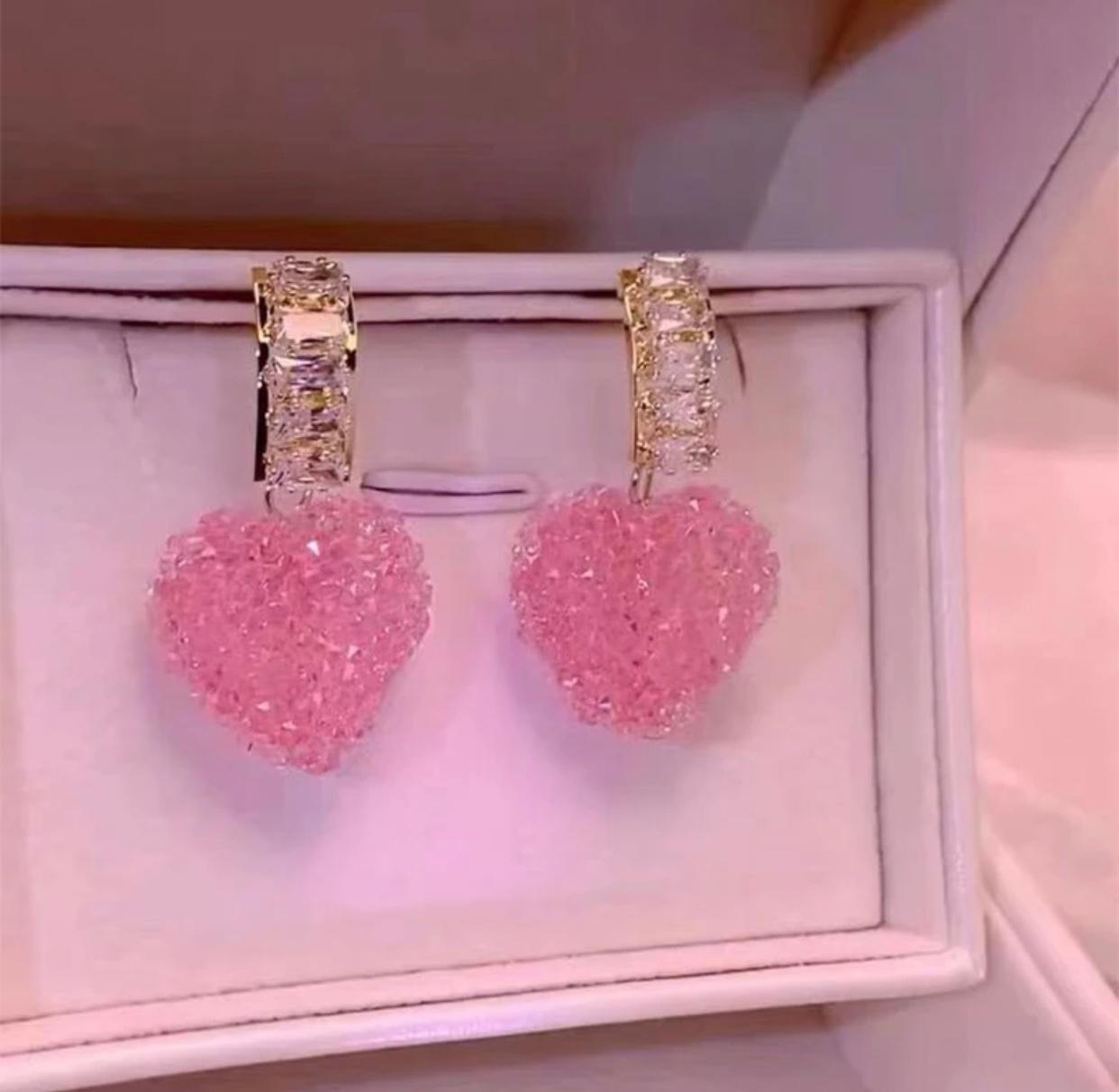 Heart shaped crystal earrings in a soft pink hue