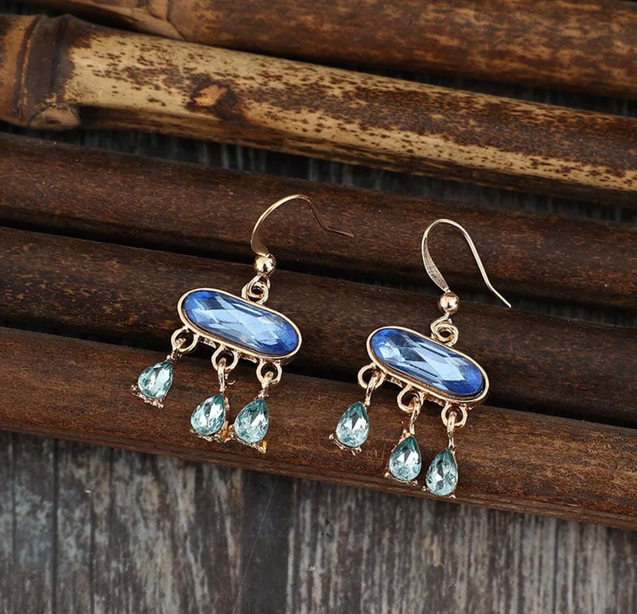 A pair of elegant blue stone water drop earrings