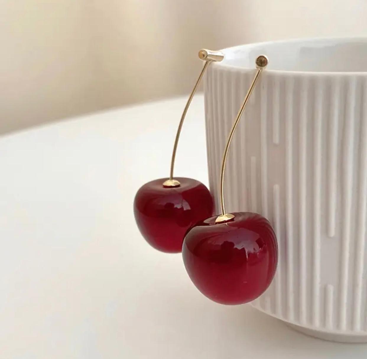 A pair of wine red acrylic cherry earrings