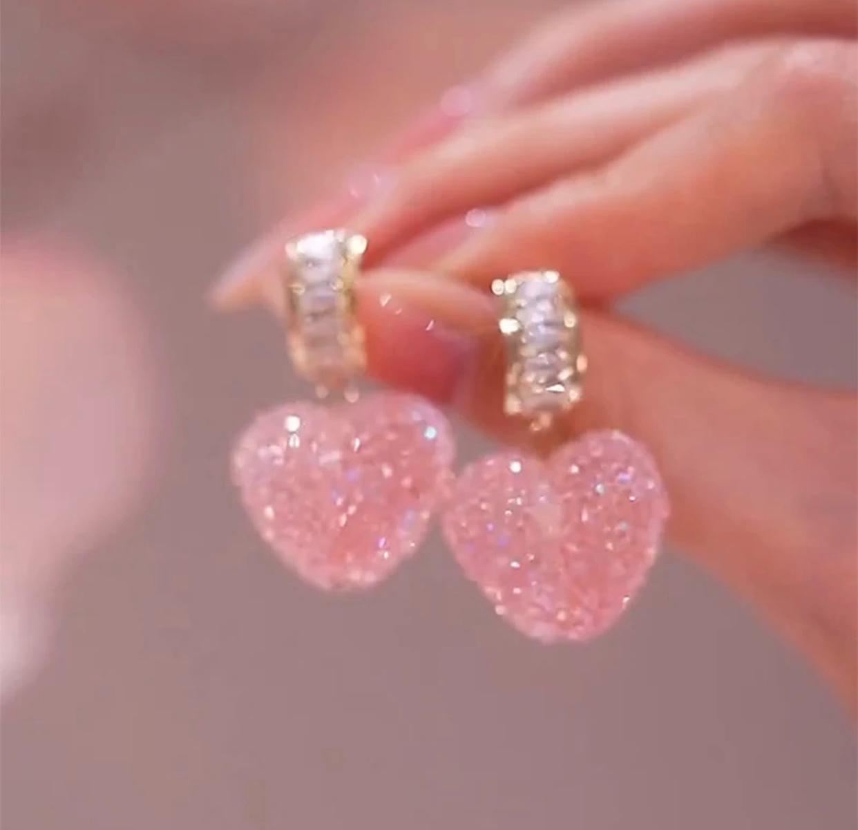 A pair of elegant pink fudge crystal heart shaped earrings for women