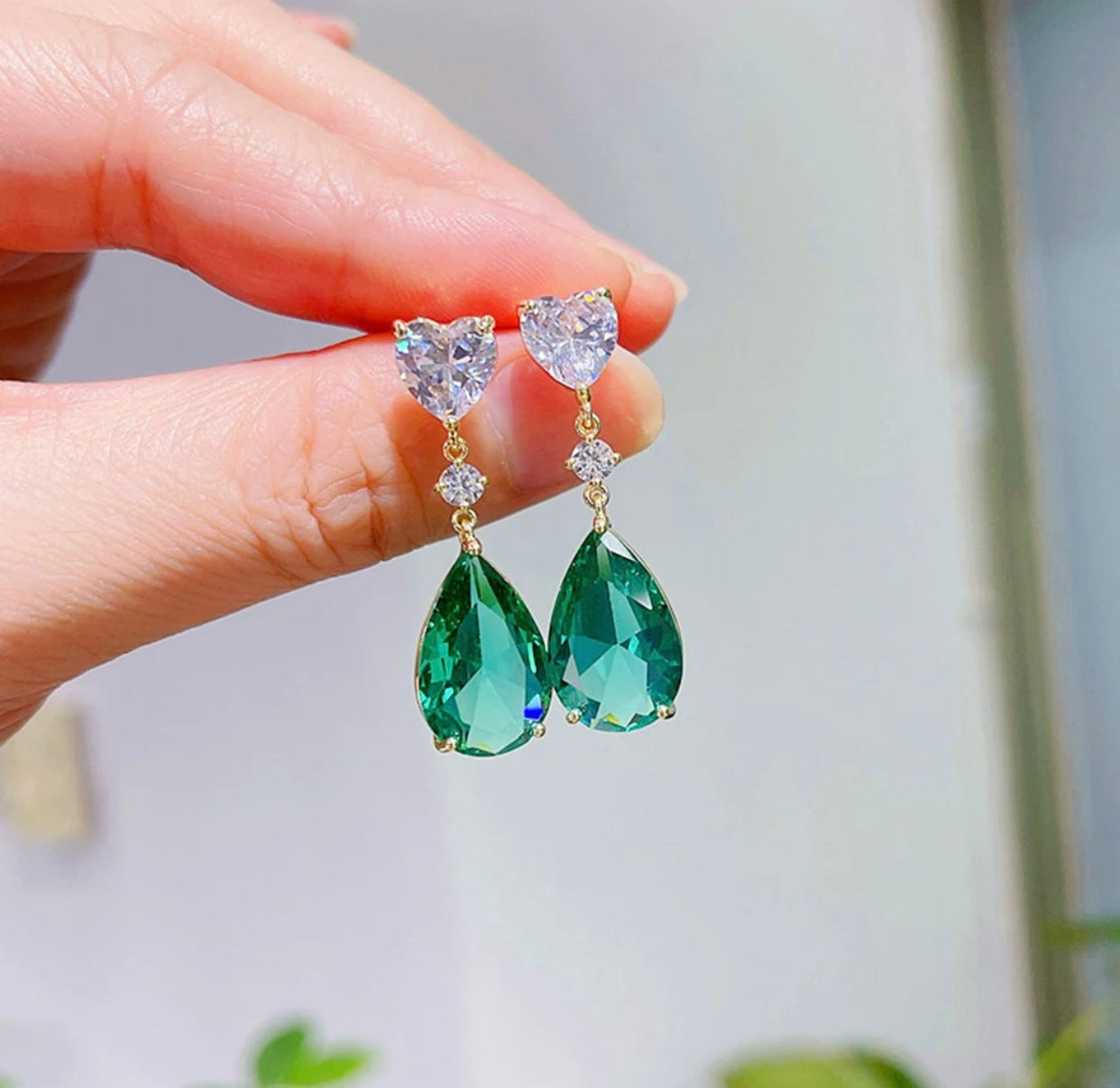 Elegant pair of cubic green zirconia earrings