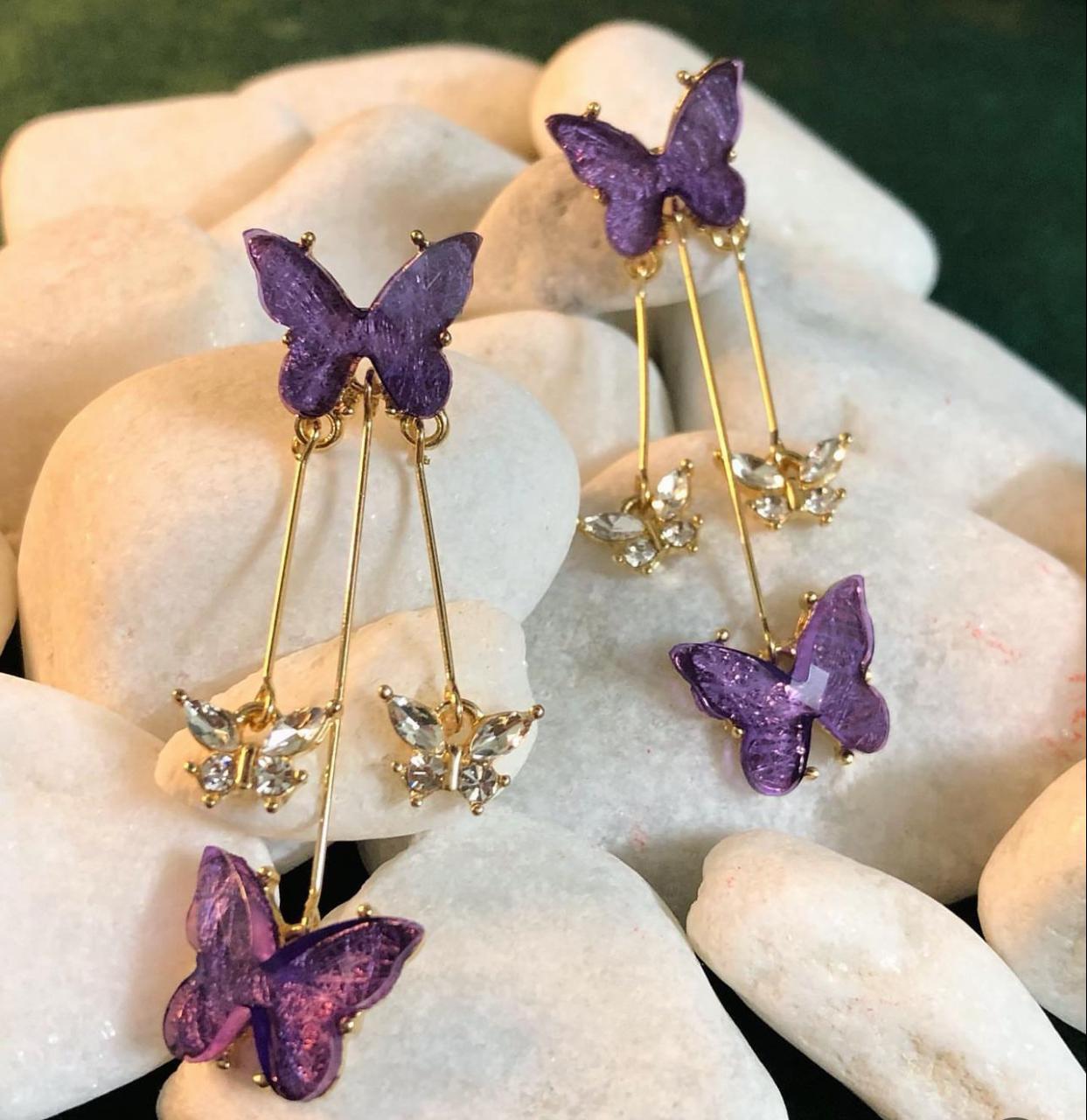 Beautiful butterfly long drop earrings with a purple stones