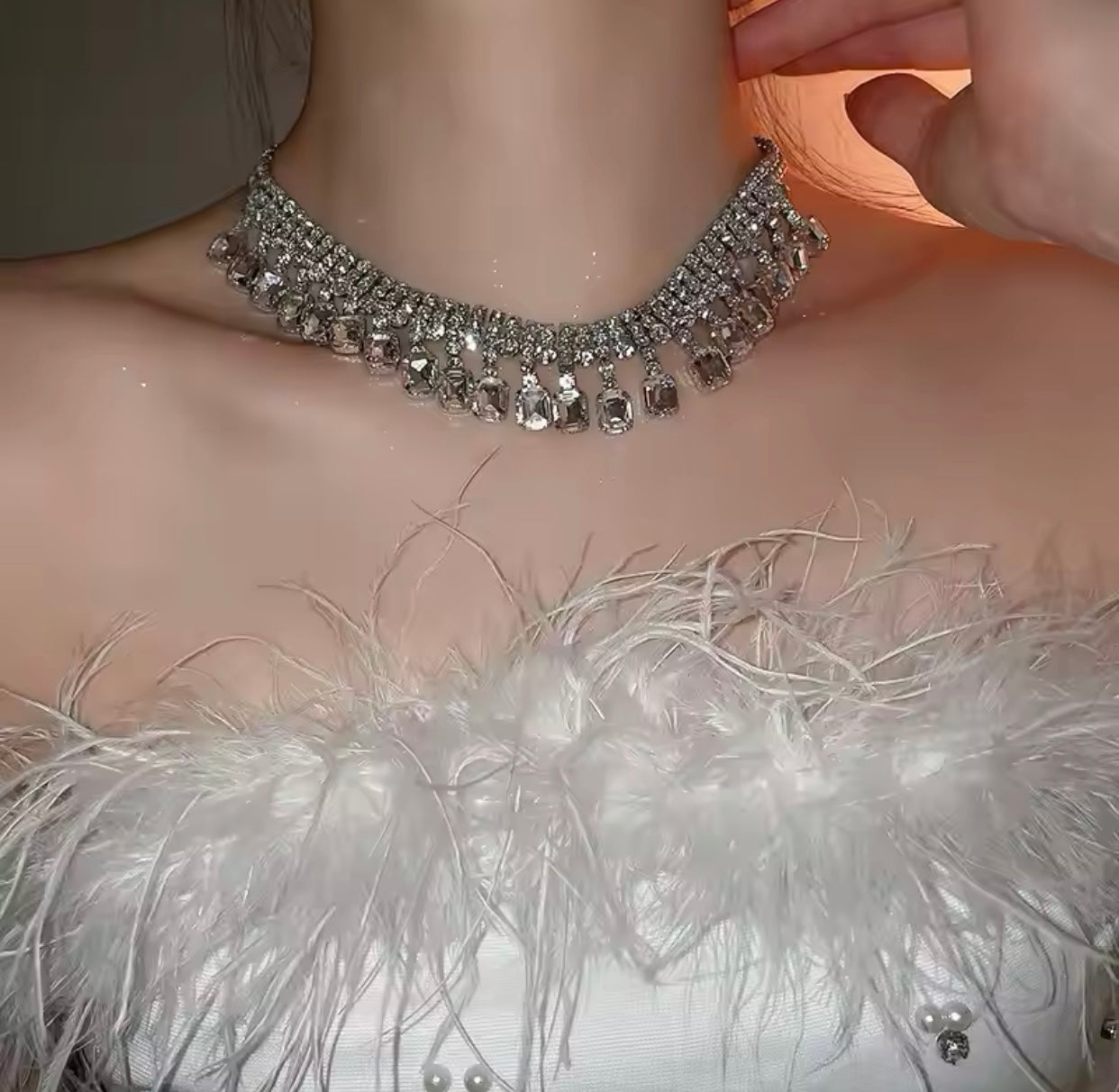 A silver necklace for women embellished with shimmering rhinestones