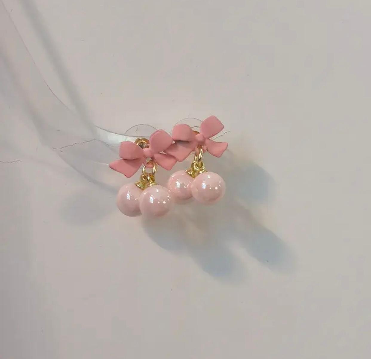 Stylish pink bow-shaped stud earrings