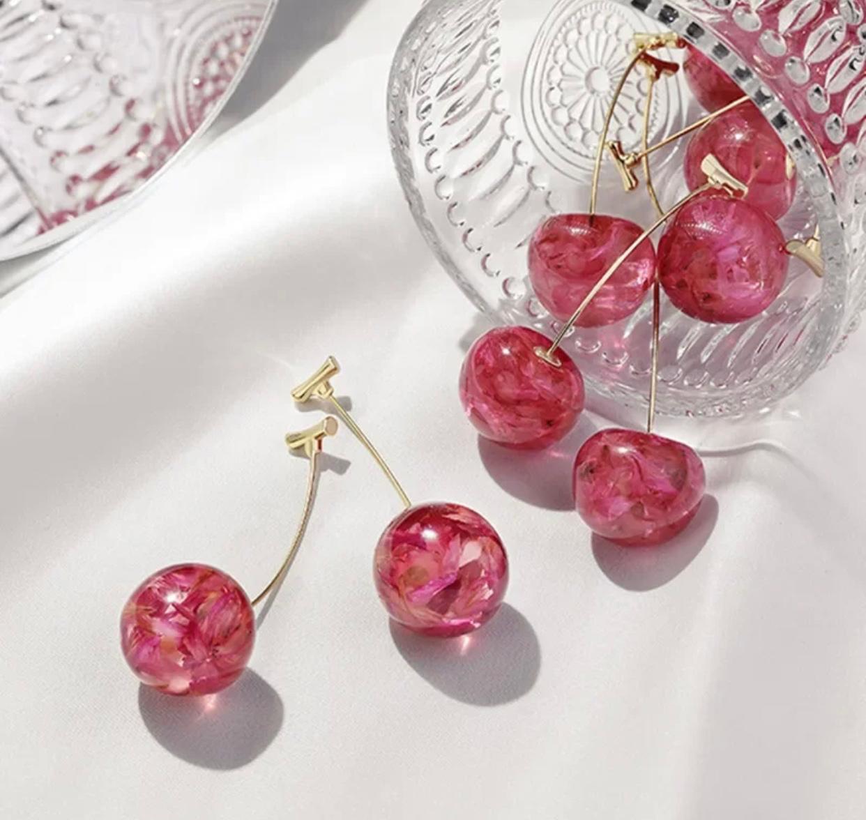 Pink acrylic long drop earrings with a unique cherry design