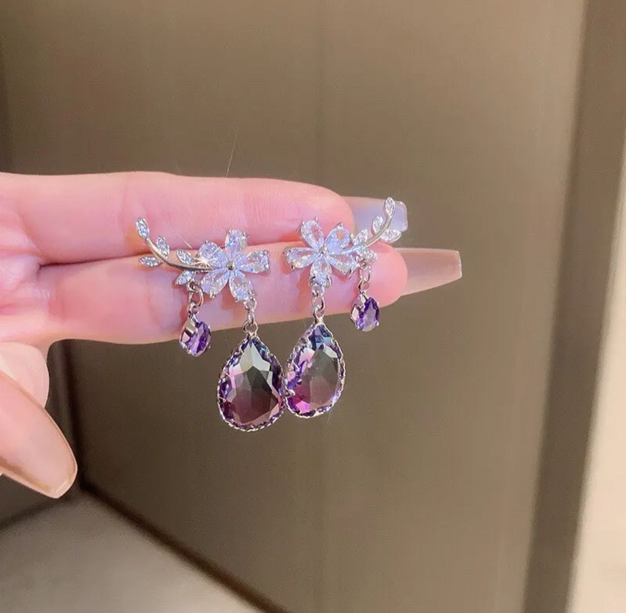 Purple zircon water drop earrings with a flower design