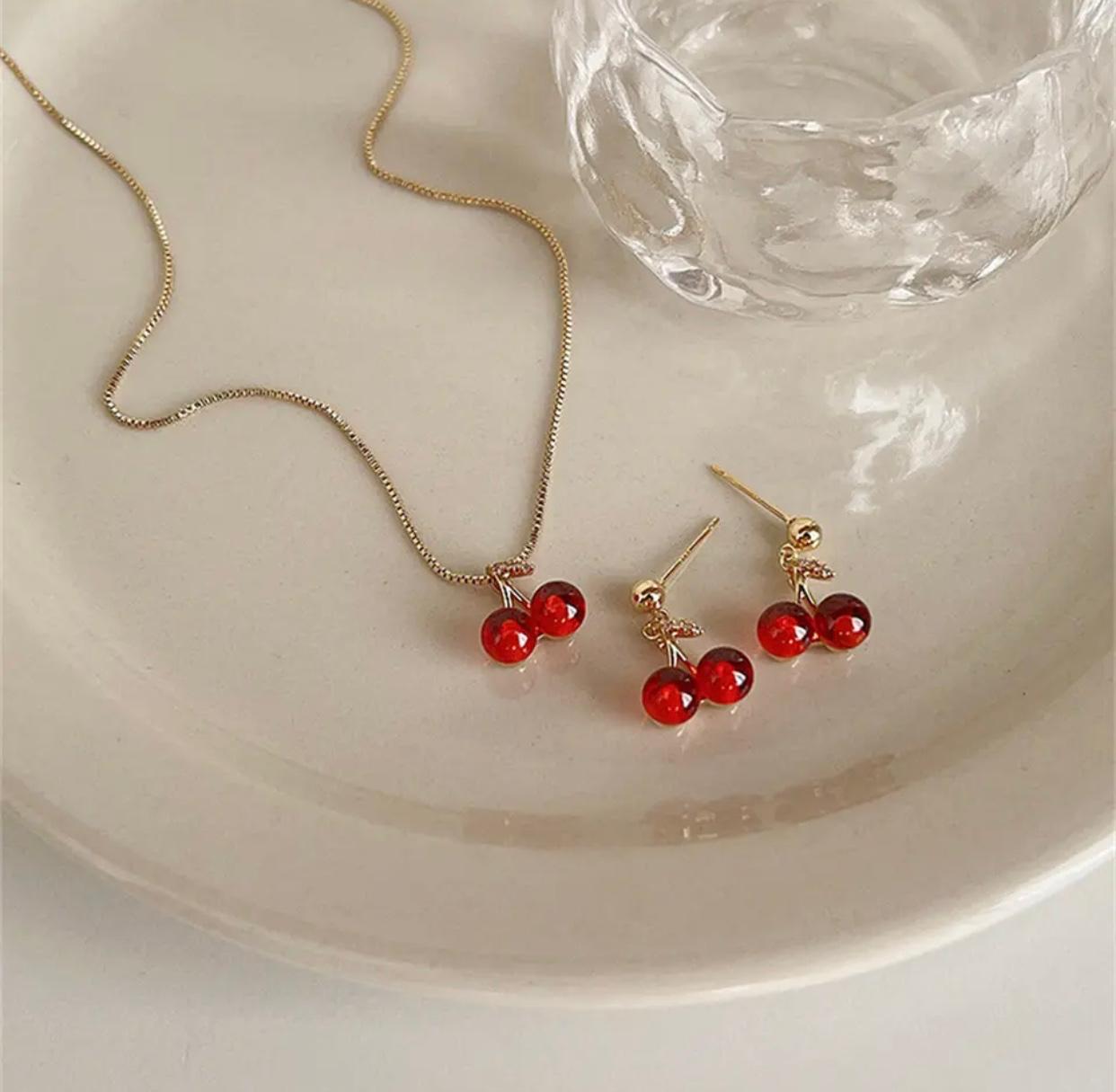 A cherry pendant earrings set in red wine color