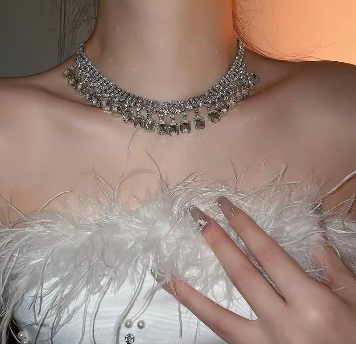 A stunning silver necklace adorned with sparkling rhinestones