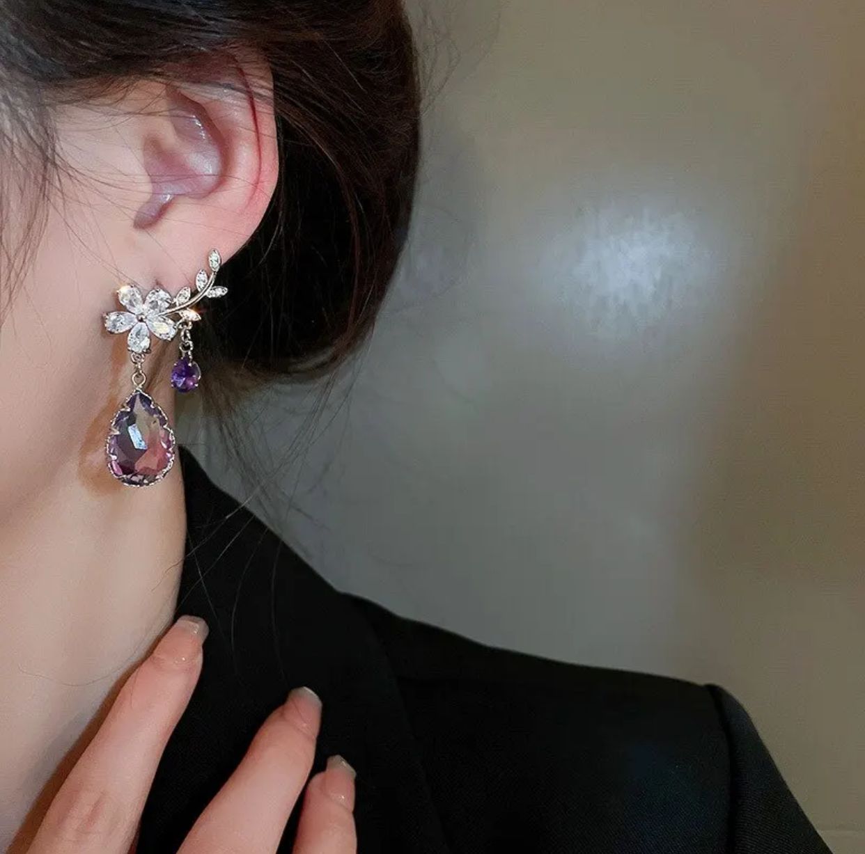 Flower earrings adorned with purple water drop shaped zircon stones