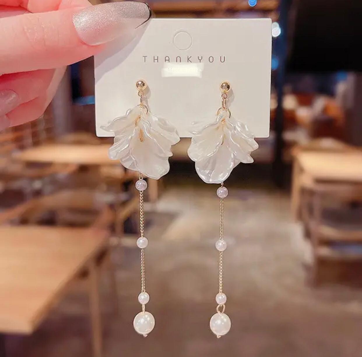 A pair of white leaf long drop pearl earrings