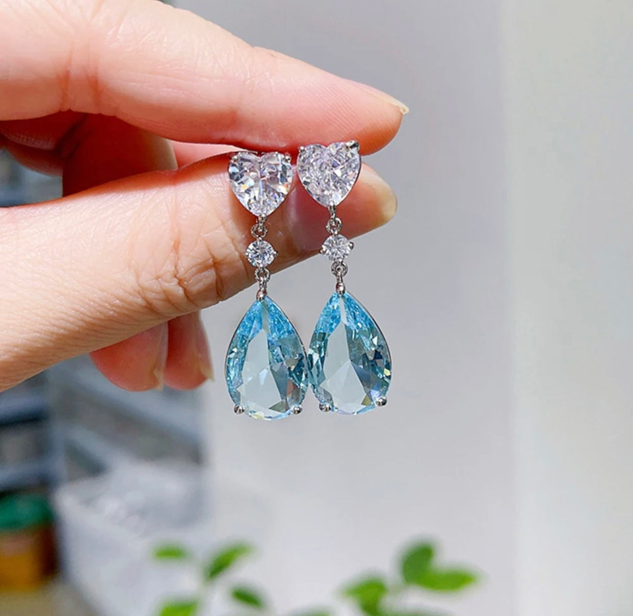 Sparkling sky blue cubic zirconia earrings set in silver