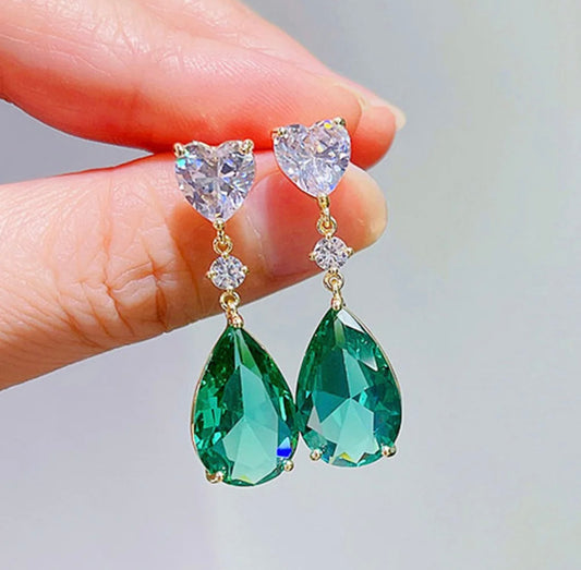 A pair of green gold colored cubic zirconia earrings for women